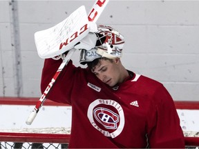 Canadiens goalie Carey Price slips on his mask during practice at the Bell Sports Complex in Brossard on Sept. 14, 2018.