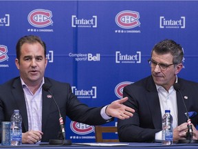 Montreal Canadiens general manager Marc Bergevin, right, listens as owner Geoff Molson speaks to reporters during an end-of-season news conference in Brossard opn April 9, 2018.