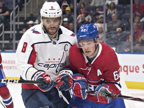 Canadiens' Artturi Lehkonen, right, is checked by Capitals' Alex Ovechkin, during pre-season action in QUebec City.