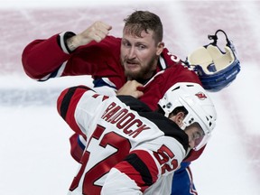 The Canadiens' Nicolas Deslauriers and the New Jersey Devils' Brandon Baddock square off during NHL pre-season game at the Bell Centre on Sept. 17, 2018.