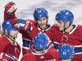 Canadiens' Tomas Tatar, left, celebrates with teammates Victor Mete (53) Phillip Danault (24), Brendan Gallagher (11) and Noah Juulsen, right, after scoring against the Ottawa Senators during third period NHL pre-season hockey action in Montreal, Saturday, Sept. 22, 2018.