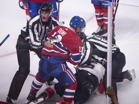 Max Domi is pulled away by linesman Ryan Daisy after a brief fight with Florida Panthers' Aaron Ekblad during third period action in Montreal on Wednesday, Sept. 19, 2018.