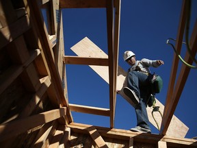 Workers build a new home.