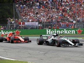 Mercedes driver Lewis Hamilton of Britain, right, steers his car followed by Ferrari driver Kimi Raikkonen of Finland during the Formula One Italy Grand Prix at the Monza racetrack, in Monza, Italy, Sunday, Sept. 2, 2018.