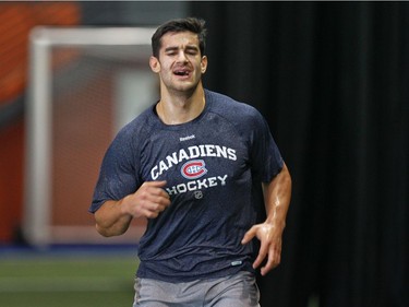 Back on track, Pacioretty grimaces while running the beep test during physical testing on the first day of training camp at the team's practice facility in Brossard, south of Montreal Wednesday Sept. 11, 2013.