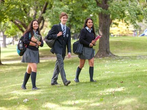 A trio of Kells Academy high school students head to their classes.