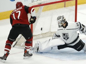 Los Angeles Kings goalie Peter Budaj makes a pad save on a shot by Arizona Coyotes centre Alex Galchenyuk during NHL preseason game in Glendale, Ariz., on Sept. 18, 2018.