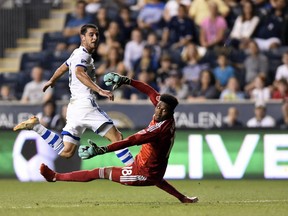 In this Saturday, Sept. 15, 2018, file photo, Montreal Impact's Alejandro Silva, left, scores a goal past Philadelphia Union goalkeeper Andre Blake in the first half of an MLS soccer match in Chester, Pa. The Impact are unexpectedly in the playoff picture after a two-month climb up the standings, but a loss on Saturday, Sept, 29, 2018, DC United leaves Montreal with only a two-point cushion.