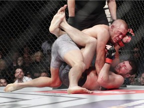Montrealer Georges St-Pierre fights England's Michael Bisping during a middleweight title bout at UFC 217 in New York on Nov. 5, 2017. Georges St-Pierre is still open to a return to fighting, but not necessarily against the winner of the Khabib Nurmagomedov-Conor McGregor fight. The fighter also explained that his recent weight loss came as a result of intermittent fasting and time restricted eating.