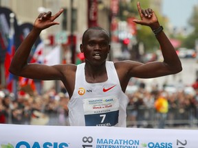 Ezekiel Mutai, the winner of the 2018 Montreal marathon, crosses the finish line.