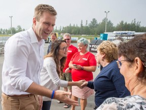 New Brunswick Liberal Leader Brian Gallant and wife Karine Lavoie are greeted by supporters after arriving at a campaign stop in Oromocto, N.B., on September 1, 2018.