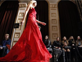 A model presents a creation by Italian fashion designer Donatella Versace as part of the Atelier Versace Spring-Summer 2015 Haute Couture fashion collection presented in Paris, France, Sunday, Jan. 25, 2015.