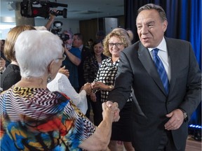 Coalition Avenir Québec Leader François Legault greets residents during a campaign stop at a seniors residence in Châteauguay on Monday, September 10, 2018.
