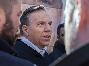 Coalition Avenir Québec Leader François Legault responds to questions from reporters during a campaign stop in Ste-Anne-des-Plaines on Saturday, September 22, 2018.