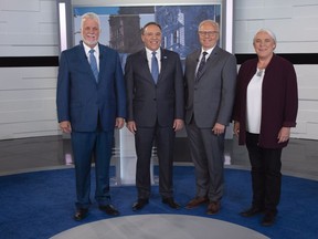Liberal Leader Philippe Couillard, Coalition Avenir Quebec Leader Francois Legault, PQ Leader Jean-Francois Lisee and Quebec Solidaire Leader Manon Masse, left to right, stans on the television set for a photo prior to Face a Face Quebec 2018, the third Quebec elections leaders debate in Montreal, on Thursday, September 20, 2018.