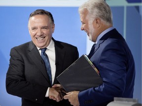 CAQ Leader François Legault, left, shakes hands with Liberal Leader Philippe Couillard after their English-language debate Monday, Sept. 17, 2018 in Montreal.