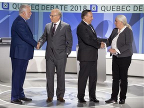 Liberal leader Philippe Couillard , left to right, PQ leader Jean-Francois Lisee, CAQ leader Francois Legault and Quebec Solidaire leader Manon Masse, right, shake hands before their English debate Monday, September 17, 2018 in Montreal, Que.
