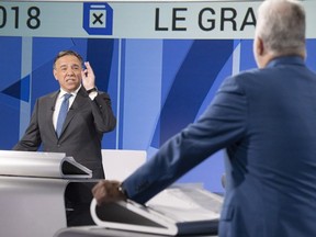 In the French debate Thursday, Liberal Leader Philippe Couillard, right, came across as calm and competent, but the sometimes fiery CAQ Leader, François Legault, was the face of "change."