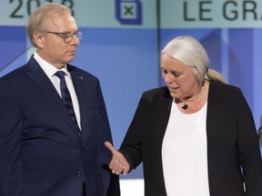 PQ leader Jean-Francois Lisée and Quebec Solidaire leader Manon Masse shake hands before the leaders' debate Sept. 13, 2018.