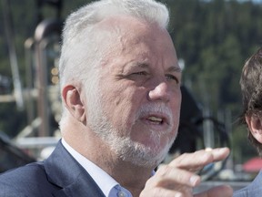 Quebec Liberal Leader Philippe Couillard responds to reporters questions during a news conference Tuesday, Sept. 4, 2018, in the Gaspé.