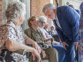 Liberal Leader Philippe Couillard greets residents at a seniors' residence during a campaign stop in Sherbrooke on Wednesday, September 5, 2018.