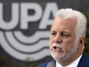 Liberal Leader Philippe Couillard responds to questions following a meeting with members of the UPA, Quebec's farmers' association, during a campaign stop in Longueuil on Thursday.