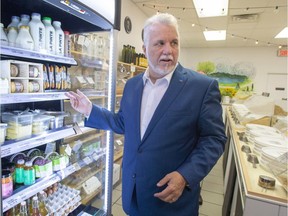 Quebec Liberal Leader Philippe Couillard visits a zero waste grocery store and cafe while campaigning, Friday, September 21, 2018 in Montreal.