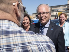 PQ Leader Jean-François Lisée greets a supporter outside Hôtel Dieu de Sorel hospital. A PQ government would reinstate public funding for in vitro fertilization, he says.