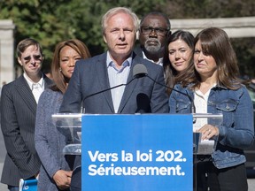 Parti Quebecois Leader Jean-Francois Lisee speaks to reporters outside McGill University during a campaign stop in Montreal, Saturday, September 8, 2018.