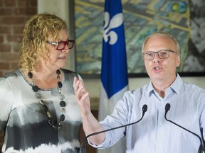 Parti Quebecois Leader Jean-Francois Lisee and candidate Michelle Blanc speak to reporters during a campaign stop in Montreal, Saturday, September 15, 2018.