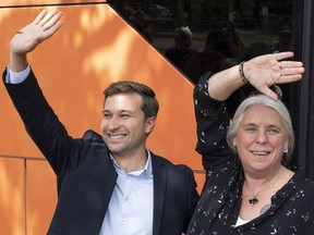 Quebec Solidaire co-spokesperson Gabriel Nadeau-Dubois and Manon Masse wave to supporters as they arrive to launch their campaign in Montreal on Thursday, August 23, 2018. Quebecers will go to the poll Oct. 1.