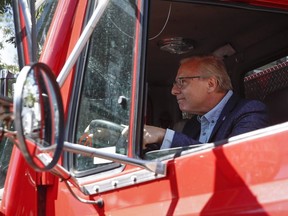 Parti Québécois Leader Jean-François Lisée drives a fire truck during Limoilou en Fete, Sunday, September 9, 2018 in Quebec City.