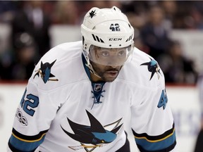 Joel Ward lines up for face-off with the San Jose Sharks during NHL game against the Arizona Coyotes.