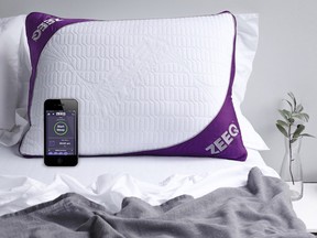 This photo provided by REM-Fit shows the Zeeq pillow, which monitors snoring and can gently vibrate to nudge someone into a different sleep position. The pillow can also play your favorite music, audio books and more without disturbing anyone next to you. A number of companies are adding more technology into their products, hoping to lure customers craving a better night’s sleep.