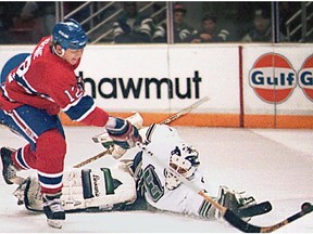Canadiens' Mike Keane beats Hartford Whalers netminder Sean Burke for a goal during the 1994-95 season.
