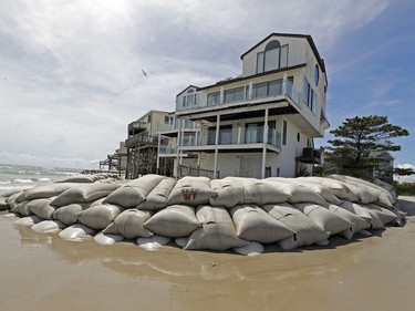 Sand bags surround homes on North Topsail Beach, N.C., Sept. 12, 2018, as Hurricane Florence threatens the coast.