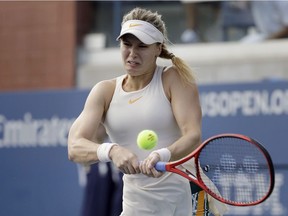 Eugenie Bouchard, of Canada, returns a shot to Marketa Vondrousova, of the Czech Republic, during the second round of the U.S. Open tennis tournament, Thursday, Aug. 30, 2018, in New York.