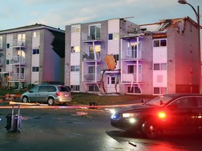 Apartment buildings are shown after a tornado torn roofs off and windows blown out after a tornado caused extensive damage to a Gatineau, Quebec neighbourhood forcing hundreds of families to evacuate their homes on Friday, September 21, 2018. A tornado damaged cars in Gatineau, Que., and houses in a community west of Ottawa on Friday afternoon as much of southern Ontario saw severe thunderstorms and high wind gusts, Environment Canada said.