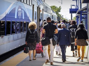 Commuters get off the AMT commuter train from Montreal at the Roxboro-Pierrefonds train station Friday June 8, 2018.