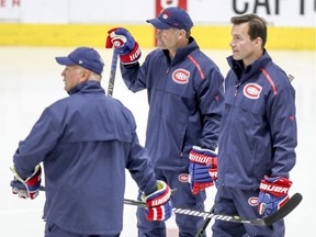 Canadiens head coach Claude Julien, left, watches drills with assistants Luke Richardson, right, and Kirk Muller during training-camp practice at the Bell Sports Complex in Brossard on Sept. 14, 2018.