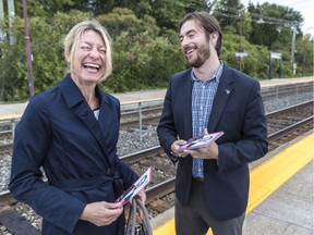 Greg Kelley, Quebec Liberal candidate for the Jacques-Cartier riding, chats with commuter Bianca Grohmann at the Baie-D'Urfe train stop, Friday.
