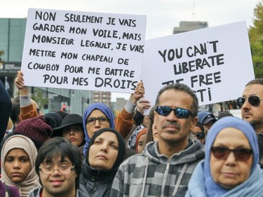 Marchers take part in an antiracism demonstration through the streets of Montreal on Sunday, Oct. 7, 2018.
