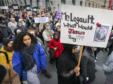 Marchers head up Peel St. during antiracism demonstration through the streets of Montreal on Sunday, Oct. 7, 2018.