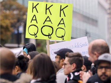 Marchers take part in an antiracism demonstration through the streets of Montreal on Sunday, Oct. 7, 2018.