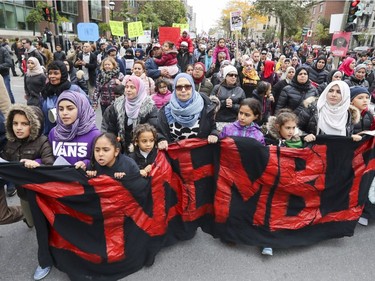 Women and children lead an antiracism demonstration in Montreal on Sunday Oct. 7, 2018.