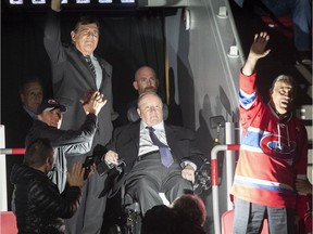 Former GM Serge Savard, left, accompanies ex-head coach Jacques Demers at the Bell Centre Thursday night as the duo were among those honoured for their role with the 1993 Stanley Cup-winning Canadiens.