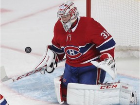 Montreal Canadiens goaltender Carey Price stops shot during first period in Montreal on Oct. 11, 2018.
