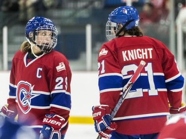 Montreal Canadiennes' Marie-Philip Poulin and Hilary Knight chat during a 3-1 loss to the Calgary Inferno at Place Bell in Laval on Sunday October 14, 2018.