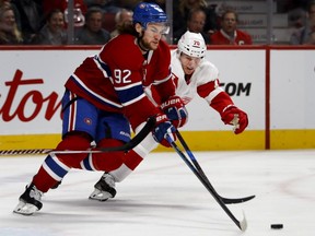 Detroit Red Wings centre Christoffer Ehn pursues Montreal Canadiens centre Jonathan Drouin as he carries the puck up the ice in Montreal on Oct. 15, 2018.