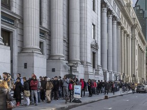 Montrealers lined up half way down Metcalfe St. in Montreal on Wednesday, October 17, 2018 to buy recreational cannabis from new store on Ste-Catherine St.